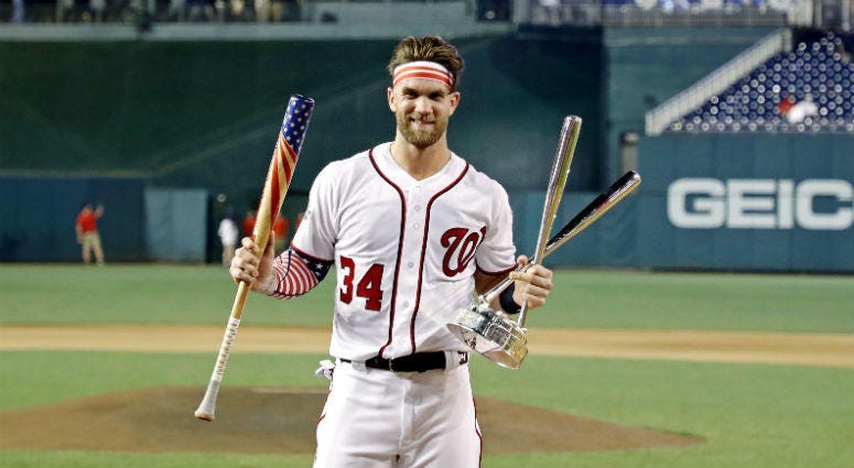 Bryce Harper celebrates winning the 2018 MLB home run derby at Nationals Ballpark. Bryce Harper celebrates winning the 2018 MLB home run derby at Nationals Ballpark.